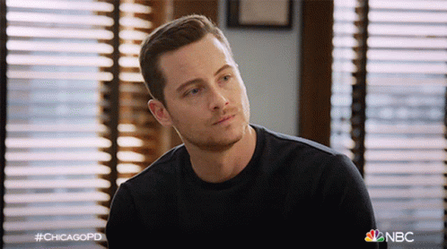 Man In Black Shirt Sitting In Front Of Window Hashtag Chicagopd GIF