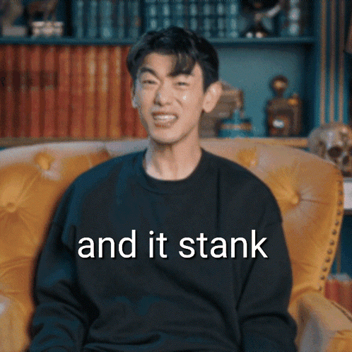 Man In Black Shirt Sitting In Yellow Chair And It Stank GIF