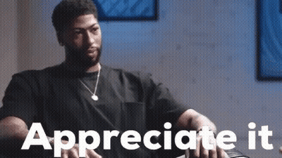 Man In Black Shirt Sitting On Couch Appreciating GIF