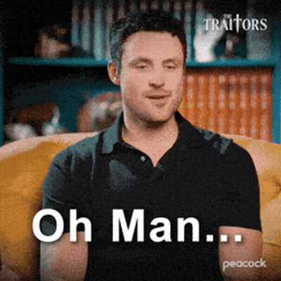 Man In Black Shirt Sitting On Yellow Couch Saying Oh Man GIF