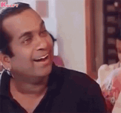 Man In Black Shirt Smiling And Laughing GIF