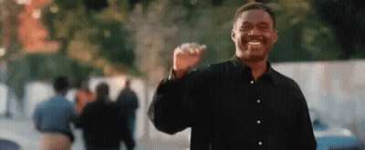 Man In Black Shirt Smiling And Making Fist GIF