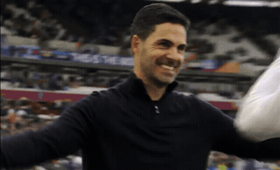Man In Black Shirt Smiling Arms Outstretched In Front Of Crowd GIF