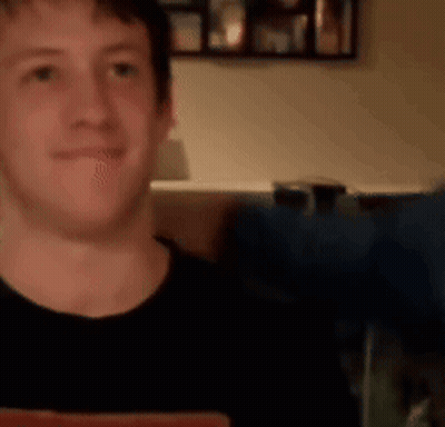 Man in Black Shirt Smiling at Camera