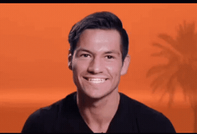 Man In Black Shirt Smiling With Palm Tree GIF