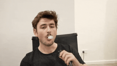 Man In Black Shirt Smoking Cigarette GIF