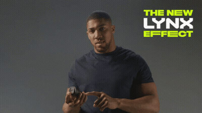 Man In Black Shirt Spraying Lynx Effect GIF