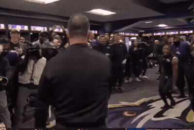 Man In Black Shirt Standing Before Group GIF