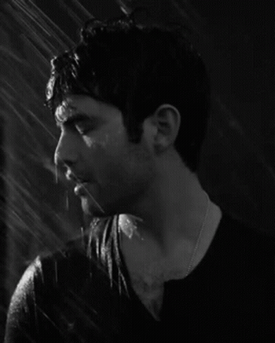 Man In Black Shirt Standing In Rain GIF