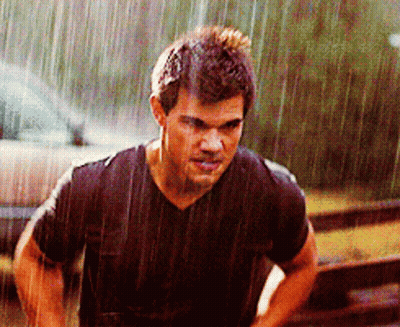 Man In Black Shirt Standing In Rain GIF