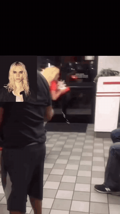 Man In Black Shirt Standing Next To Woman In Red Dress GIF
