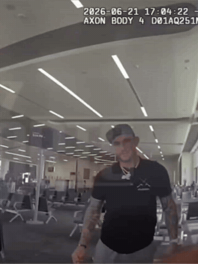 Man In Black Shirt Standing With Axon Body 4 GIF