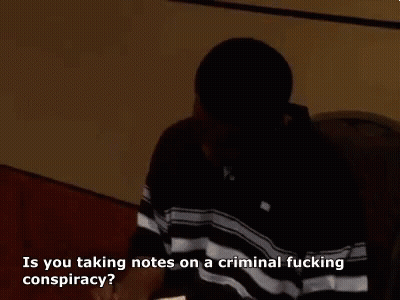 Man In Black Shirt Talking About Criminal Conspiracy Notes GIF
