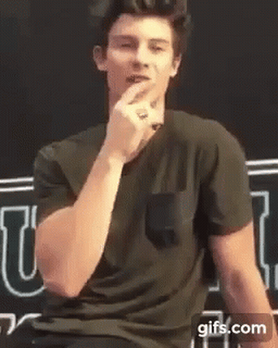 Man In Black Shirt Talking Into Microphone GIF
