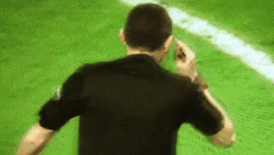 Man In Black Shirt Talking On Cell Phone Soccer Field GIF