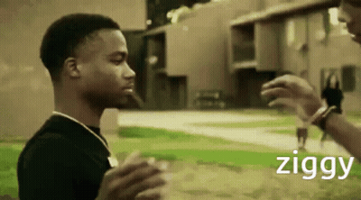 Man In Black Shirt Talking To Ziggy GIF
