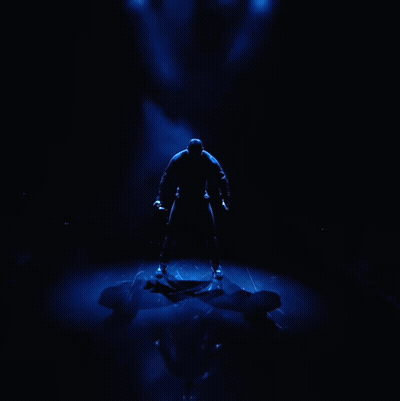 Man In Black Shirt Tie Before Blue Light GIF