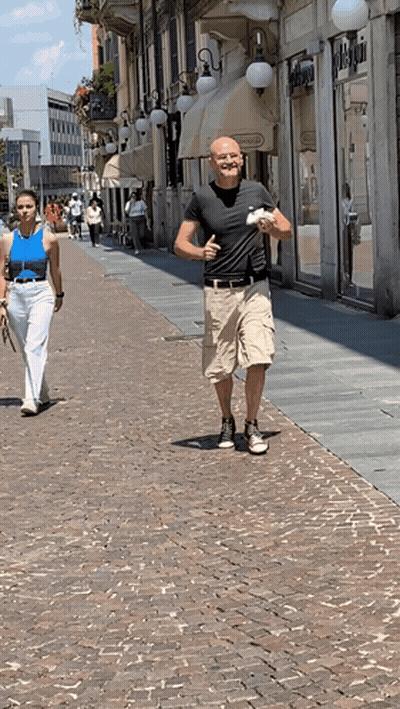 Man In Black Shirt Walking With Woman In Blue Tank Top GIF