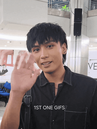 Man In Black Shirt Waving Hand GIF