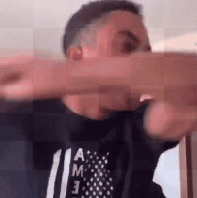 Man In Black Shirt With American Flag Making Funny Face GIF