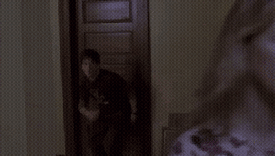 Man In Black Shirt With D In Dark Room GIF
