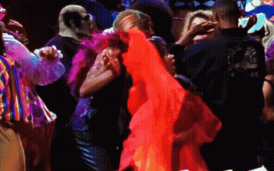 Man In Black Shirt With Dragon Dancing With Woman In Red Dress GIF