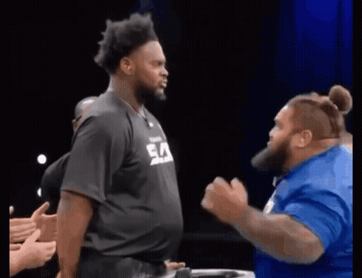 Man In Black Shirt With Ea Next To Man In Blue GIF