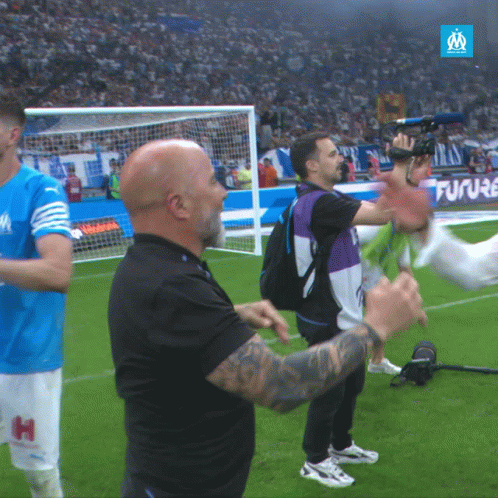 Man In Black Shirt With H On Shorts On Soccer Field GIF