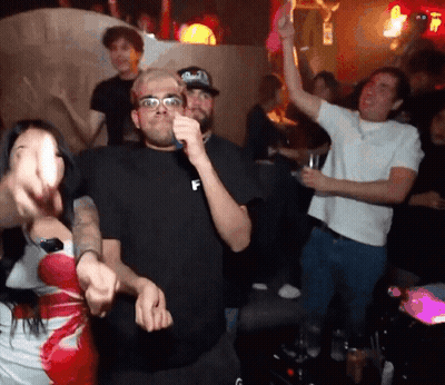 Man In Black Shirt With Letter F Dancing In Crowd GIF