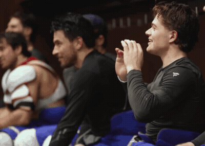 Man In Black Shirt With Letter F In Locker Room GIF