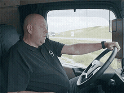 Man In Black Shirt With Letter G Driving Truck GIF