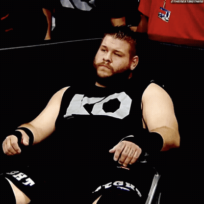 Man In Black Shirt With Letter K In Wheelchair GIF
