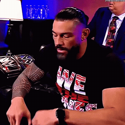 Man In Black Shirt With Love Sitting On Couch GIF