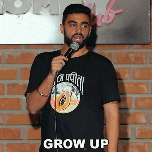 Man In Black Shirt With Papaya Says Grow Up GIF
