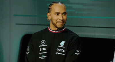 Man In Black Shirt With Petronas Ineos And UBS Logos GIF