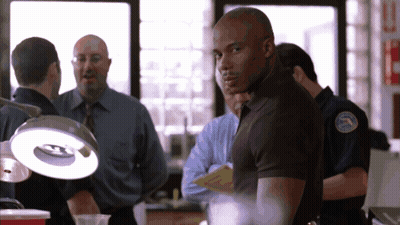 Man In Black Shirt With Police Patch GIF