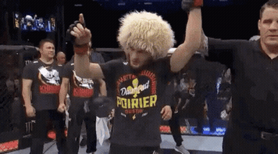 Man In Black Shirt With Pourier In Ring GIF
