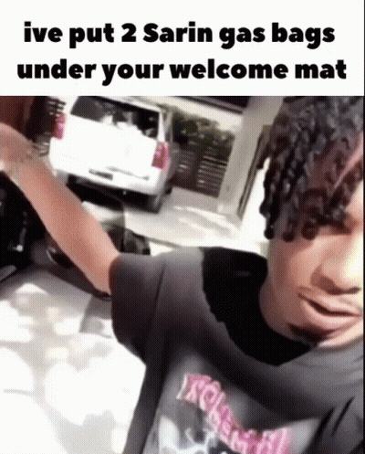 Man In Black Shirt With Welcome Mat Joke GIF