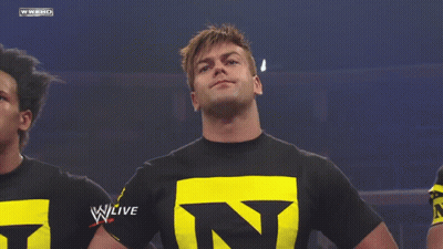 Man In Black Shirt With Yellow Letter N GIF