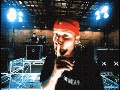 Man In Black Sportswear Shirt Shushing GIF