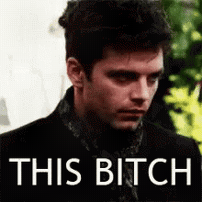 Man In Black Suit And Scarf Saying This Bitch GIF