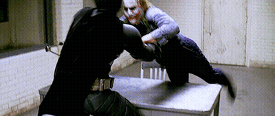 Man In Black Suit Fighting Man In Purple Suit GIF