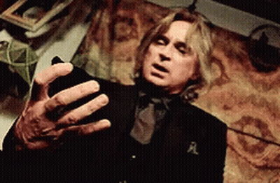 Man In Black Suit Holding Cell Phone GIF