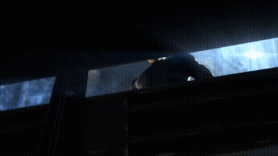 Man In Black Suit Looking Out Window GIF