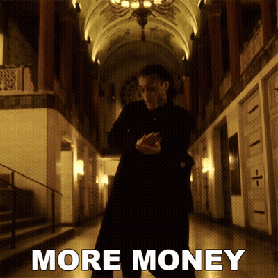 Man In Black Suit Saying More Money GIF