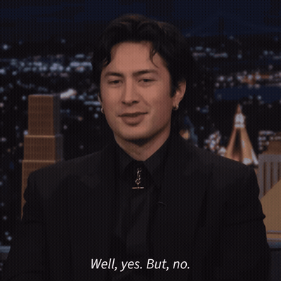 Man In Black Suit Smiling Says Well Yes But No GIF