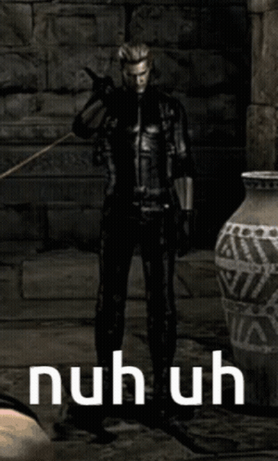 Man In Black Suit Standing By Vase Saying Nuhuh GIF