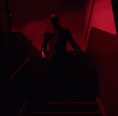 Man In Black Suit Walking Down Stairs GIF