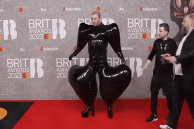 Man In Black Suit Walking On Brit Awards 2023 Red Carpet GIF