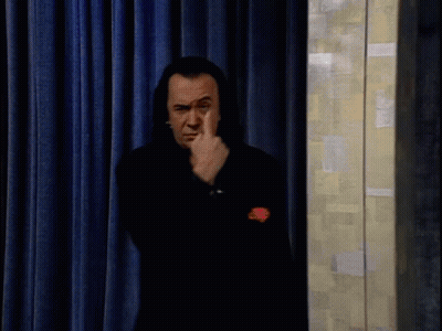Man In Black Suit Waving Hand GIF